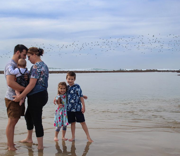 Family at the water's edge