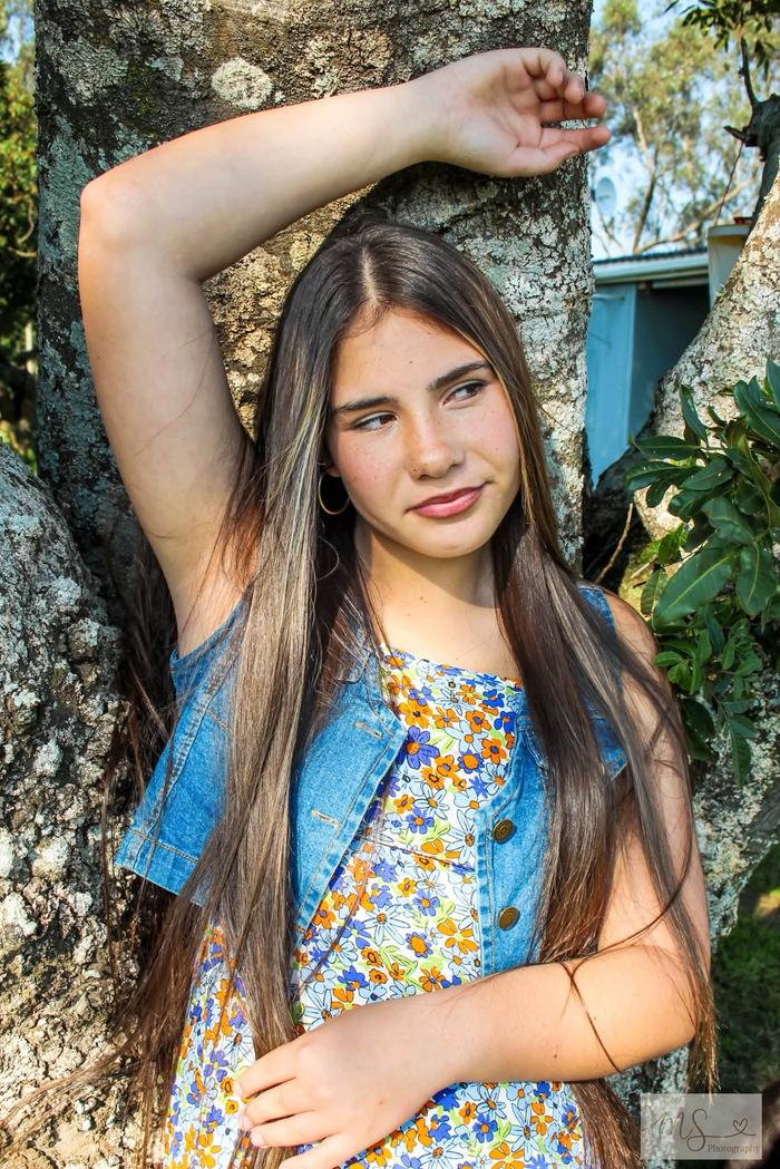Teen portrait session beside a tree